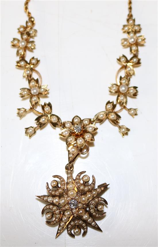 A late Victorian gold, split pearl and diamond star and crescent pendant on a similar foliate necklace with rope-twist chain,